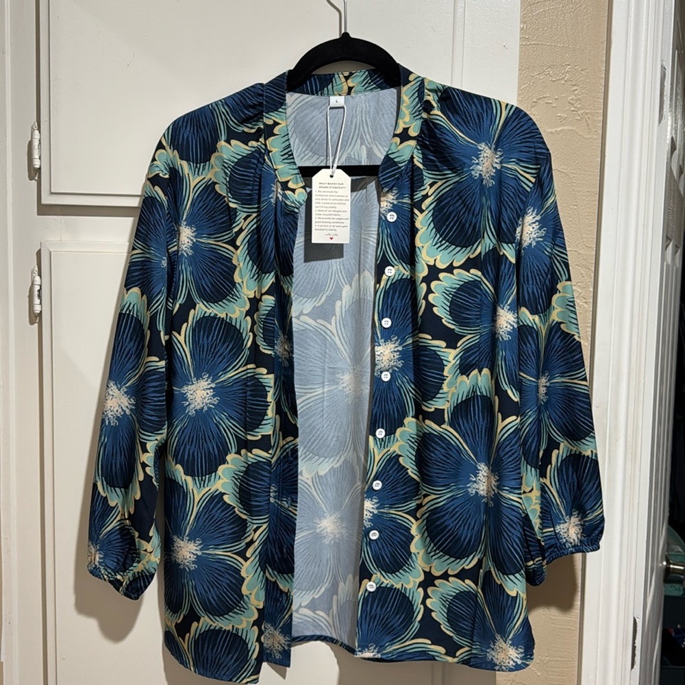 NWT - women’s floral size large blouse with three-quarter length sleeves